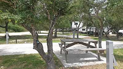 Large RV sites at Enchanted Oaks RV Park in Rockport, TX